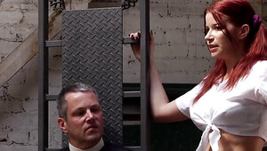 Thick redhead in a sexy suit plays with a submissive fellow