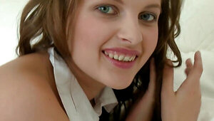 Schoolgirl with a sexy face is fingering herself hard
