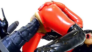 Kinky woman wearing latex and boots while riding