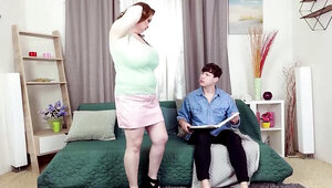 Mature woman with huge boobs seducing a younger fellow
