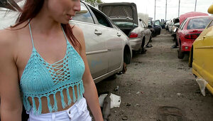Attractive brunette riding a young stud in the car