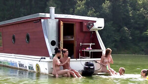 In a boat where they are having a wild summer adventure