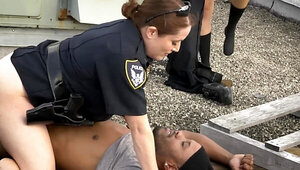 Two cop ladies and one black man are having 3some on the roof