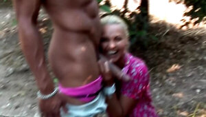 Marvelous blonde girl is sucking a hard cock in the woods