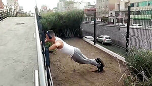 Muscular guy works out and meets with a street agent