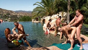 Several women are getting fucked in a hot orgy by the pool