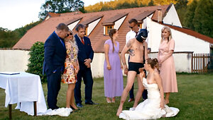 A man in a dog mask is fucking the bride while outside
