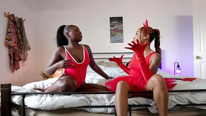 Two ebony chicks are cosplaying like slutty devils