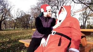 Santa Claus is celebrating Christmas with a brunette