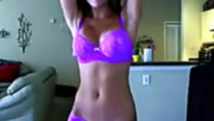 Scorching female unclothes dances and leaps on webcam