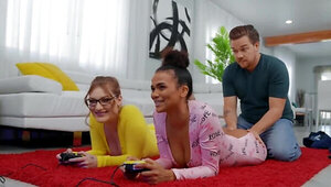 Interracial threesome makes the girls forget about video game