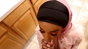 Cute ebony is wearing a hijab and feasting on a BWC