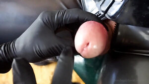 Tied up gimp endures some cock and balls torture by a mistress