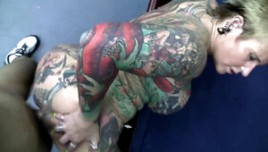 Tattooed MILF gets her pierced clit railed