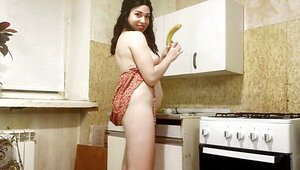 Horny and lonesome brunette fucks a banana for some reason