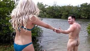 Gorgeous blonde and a hung guy are fucking by the river