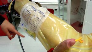 A woman in a leather outfit plays with a masked dude