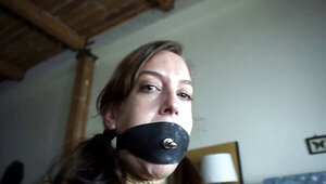 Elise Graves is filmed while struggling in tight rope bondage