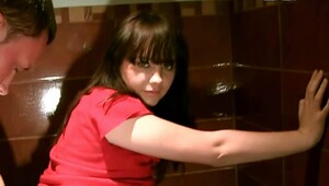 A sexy woman is in the public restroom, making a sex tape video