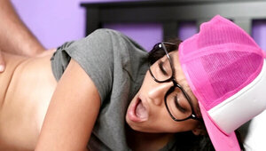 Nerdy Latina in pink cap finds big cock in a pile of laundry