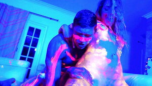 Covered with neon paint lovelies have group sex in blue light