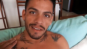 Tattooed Latino with a nice torso relaxing in the pool