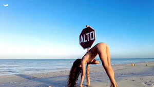 Flexible girl doing naked cartwheels and being free-spirited
