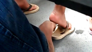 Real hidden footsie with dame in bus she enjoys