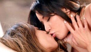 Sweet looking lesbians strokes vaginas with sex toy