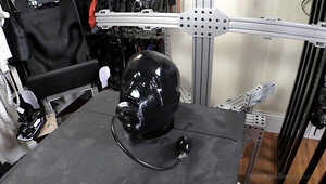 Gimp in tight latex bondage is tortured by a dirty mistress