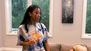 Blonde and ebony babe in a lesbian action on the floor