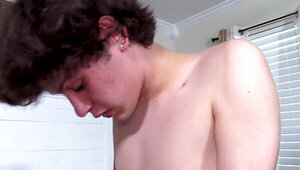 Zealous twink with dark hair playing with his friend