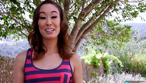 Asian-American cougar gets naked and fingers her snatch