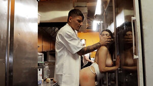 Juicy girl is fucked by a horny cook in the kitchen