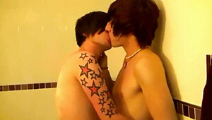 Alternative teen with tattoos making love to his partner