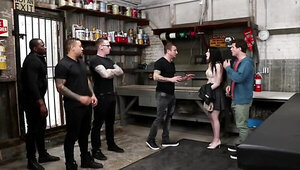 Slutty girl is fucked by a bunch of guys in a warehousde