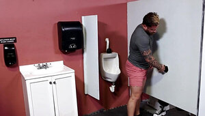 Riley Mitchel goes to the gloryhole to play with a big cock