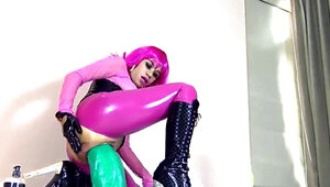 Perverted amateur wears a latex suit and rides a big toy