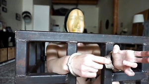 Elise Graves handcuffs herself and masturbates in a cage