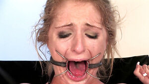 Vintage BDSM scene in which Harmony Rose dominates