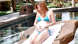 Ginger cutie masturbates and copulates by the pool