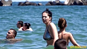Girl sunbathe topless but voyeur films tits