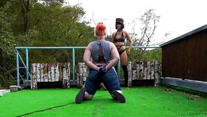 Two horny ladies are doing a fetish photoshoot outdoors