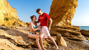 Hot Brunette On The Beach Sucks And Rides Lifeguards Cock