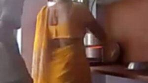 Sly hubby fucks and records Indian wife in the kitchen