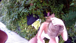 Slutty blonde is giving head and pussy in the garden