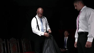 Suited men are dominating a teen with a great torso