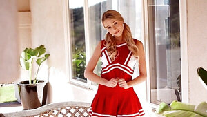 A cute blonde cheerleader can finally relax from the long day