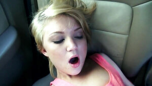 Petite blonde girl is having genital interaction in the car