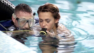 Alexis Brill and diving instructor are making out by the pool